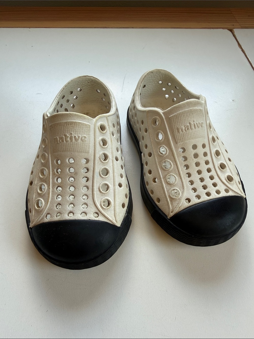 Native Kids Cream Slip-On Water Shoes with Black Toecaps